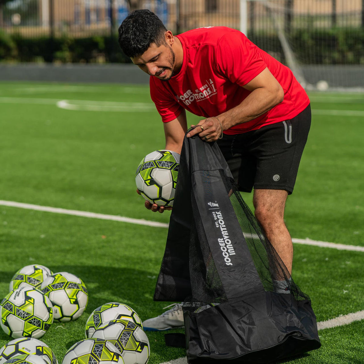 Coach filling the Heavy Duty Soccer Ball Bag