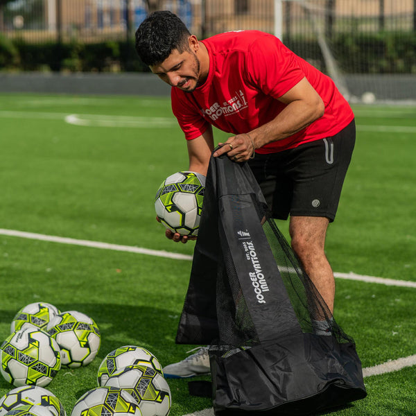 Coach filling the Heavy Duty Soccer Ball Bag