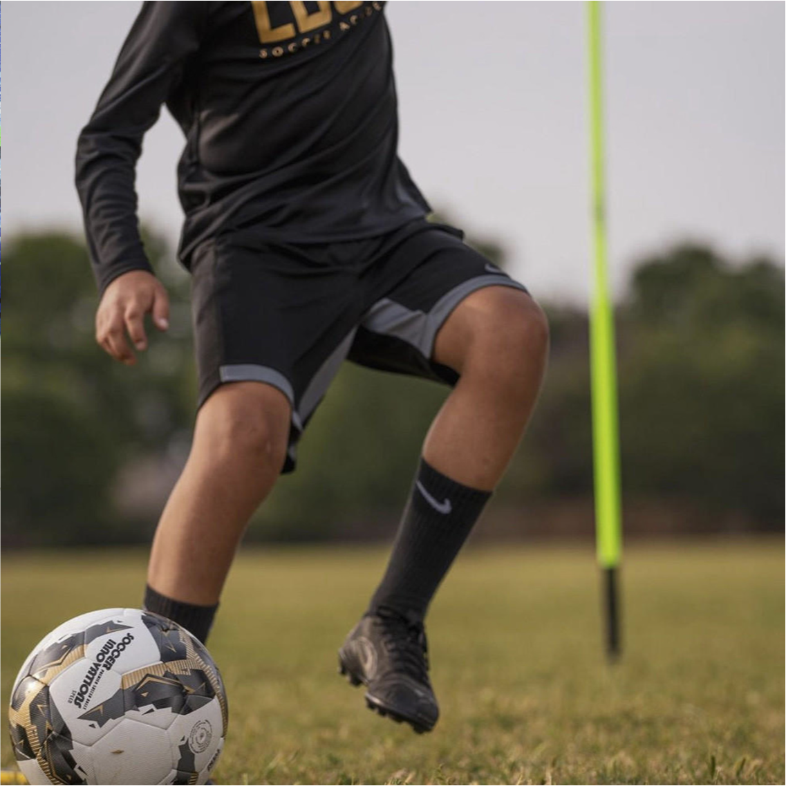 Black & Gold NFHS Approved DuelTech Soccer Ball in Play