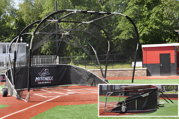 Outdoor portable batting cage on wheels used for baseball practice on a grass field with protective netting