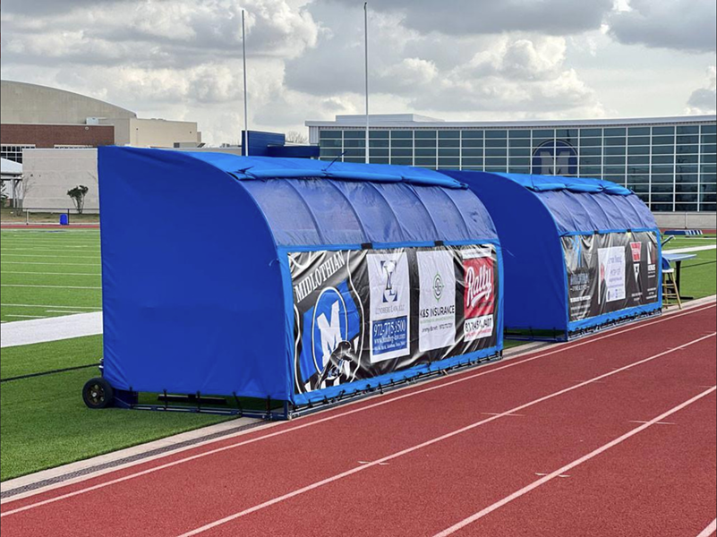 Portable Team Shelter with bench and canopy providing sun and rain protection for soccer players on the sideline