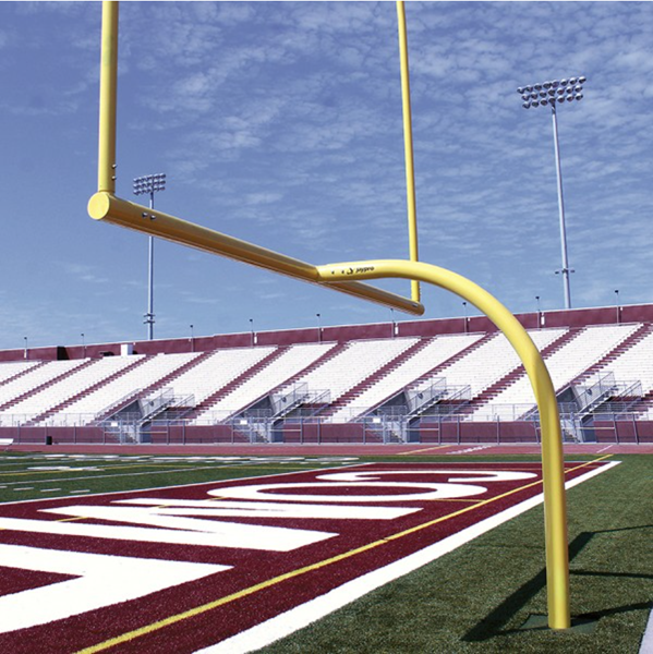 American football goal posts with safety padding and protective covers on a high school field