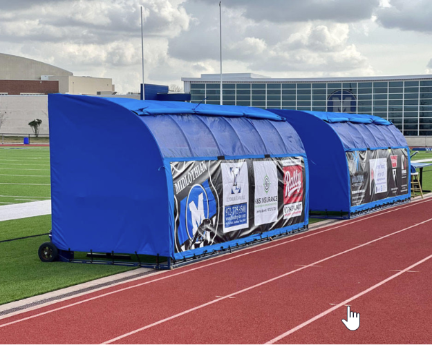 Custom football team shelter with weather-resistant cover Custom blue team shelter with weather-resistant cover and wind flap on an outdoor athletic field