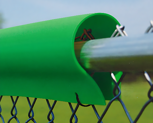 Kelly green fence top protector guard installed on a chain link fence for baseball and sports field safety