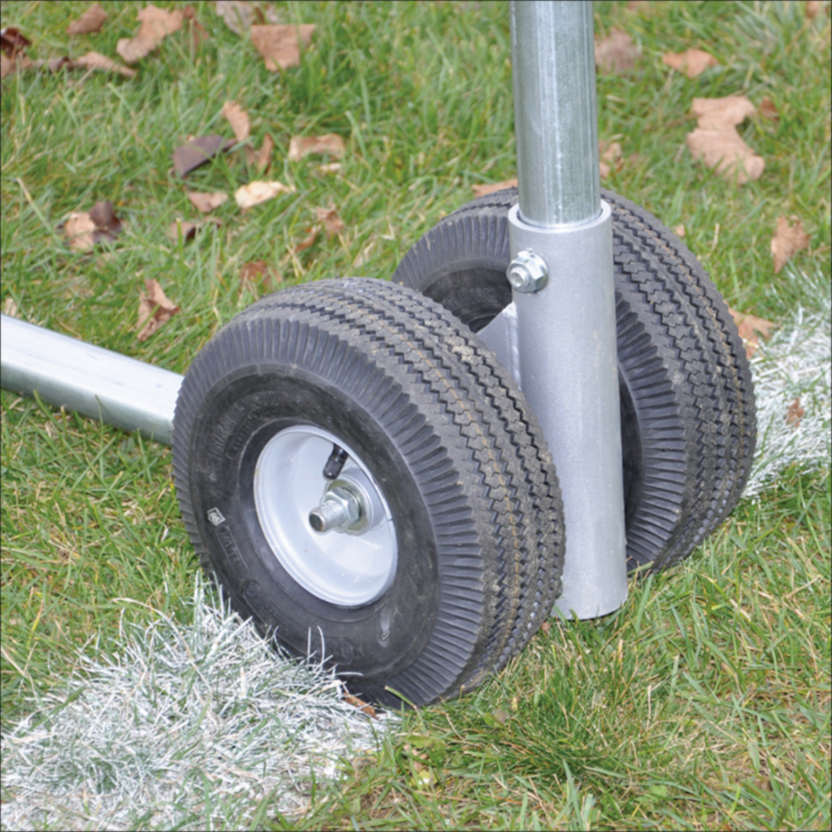 Close-up of dual no-flat wheels attached to the Jaypro portable high school football practice goal frame.