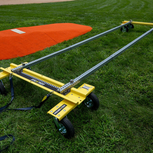 Mound Taxi transport system assembled beside a portable pitching mound on grass