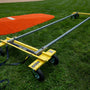 Mound Taxi transport system assembled beside a portable pitching mound on grass