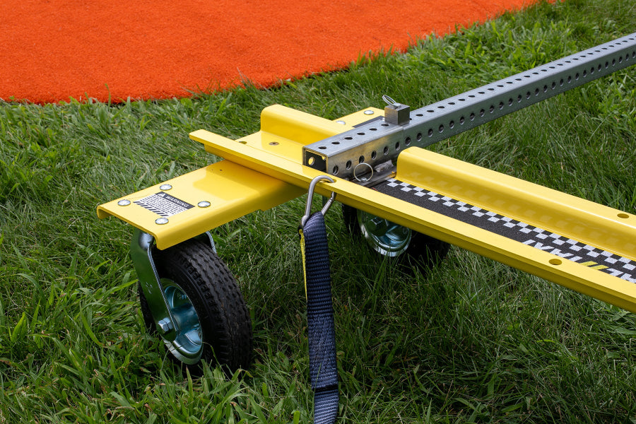 Close-up of Mound Taxi wheel, strap, aluminum rail, and locking pin assembly