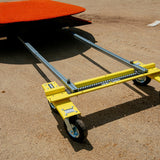 Mound Taxi positioned under a portable pitching mound on a baseball infield
