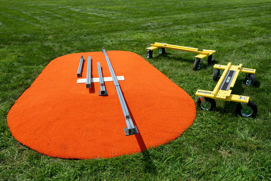 Mound Taxi parts arranged on portable pitching mound with Goal Taxi units nearby