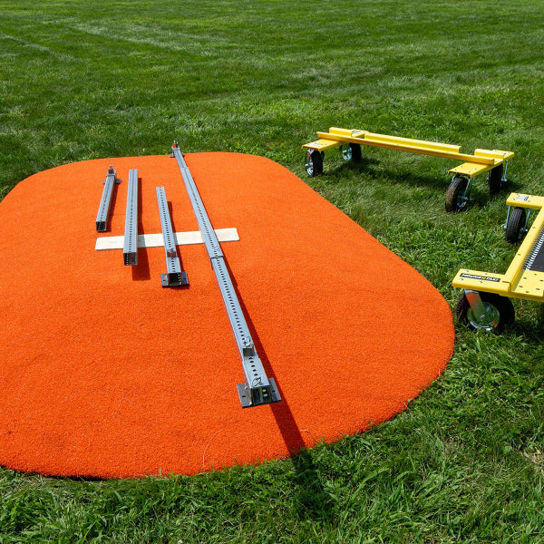 Mound Taxi parts arranged on portable pitching mound with Goal Taxi units nearby