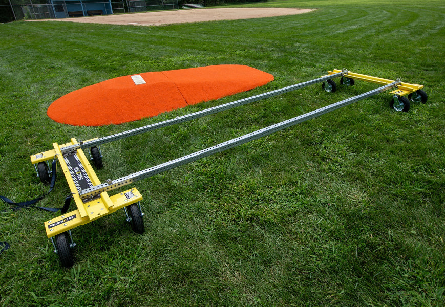 Mound Taxi frame assembled on grass in front of a portable pitching mound