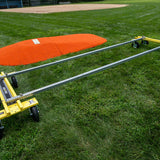 Mound Taxi frame assembled on grass in front of a portable pitching mound