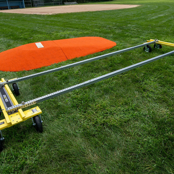 Mound Taxi frame assembled on grass in front of a portable pitching mound