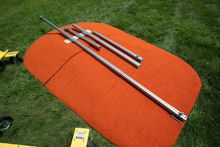 Mound Taxi extension kit laid out on top of orange portable pitching mound