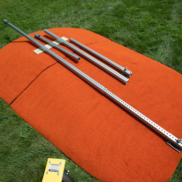 Mound Taxi extension kit laid out on top of orange portable pitching mound