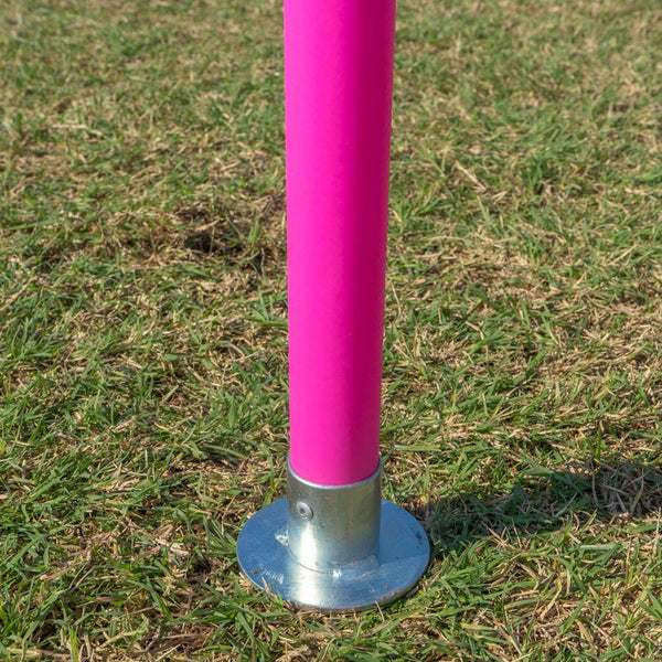 Pink Unbreakable Pro Agility Poles in the ground