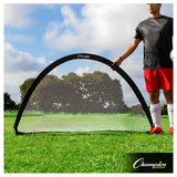 Portable half-moon pop-up soccer goal set up on grass field with player holding frame, durable white mesh net and black flexible frame ideal for backyard and small-sided training