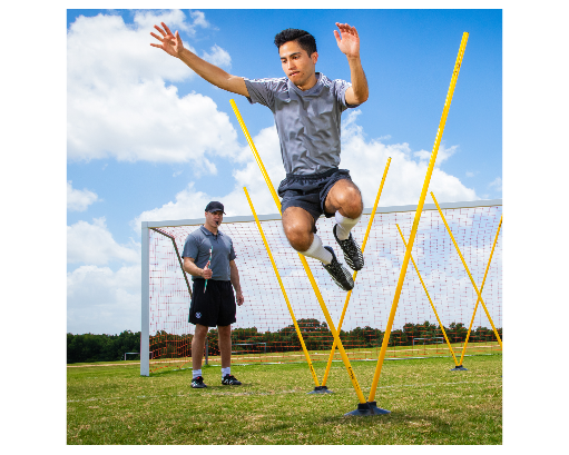 Soccer agility training drill using Pro Agility Pole Set with coach observing athlete performing speed jump drill