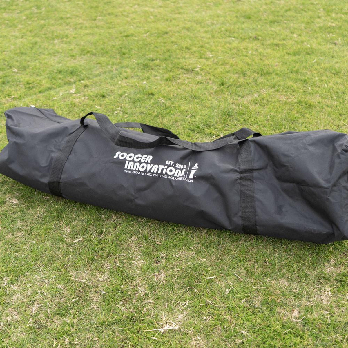 Black bag with 'Sogger Innovations' logo on a grassy field