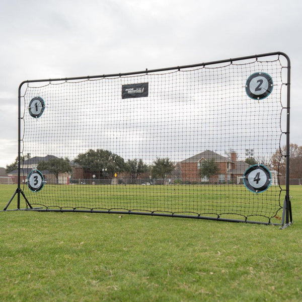 Outdoor sports training net with numbered sections on a grassy field