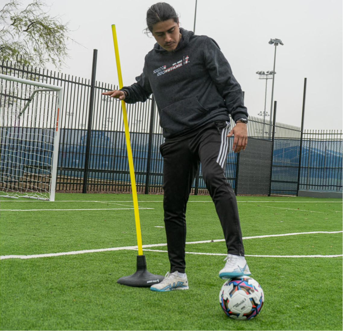 Solid rubber jumbo base for agility poles on turf and grass