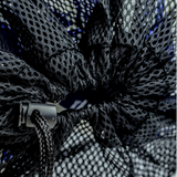 Close-up of black drawstring closure and cord lock on a mesh soccer ball bag